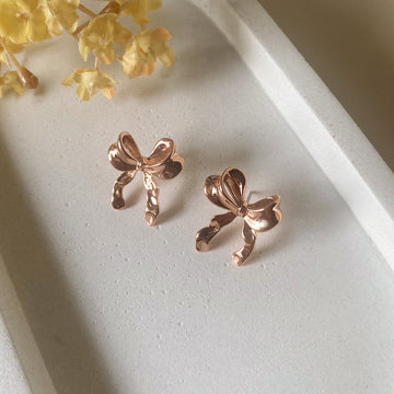 Gentle Glow Bow Studs Earrings - Rose Gold