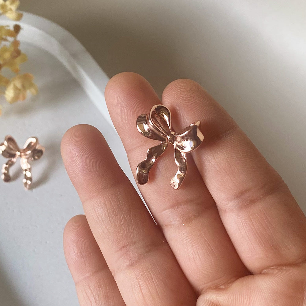 Gentle Glow Bow Studs Earrings - Rose Gold